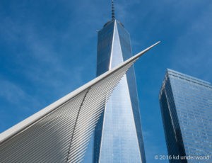Modern skyscrapers against a clear blue sky.