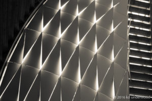 Futuristic geometric pattern with illuminated triangles.