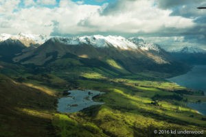 Mountain landscape with lake and clouds.