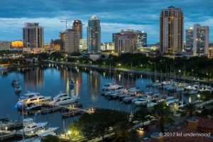 City skyline and marina at dusk.