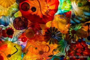 Colorful abstract glass ceiling art installation.
