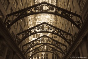 Ornate metal arches in a building interior.