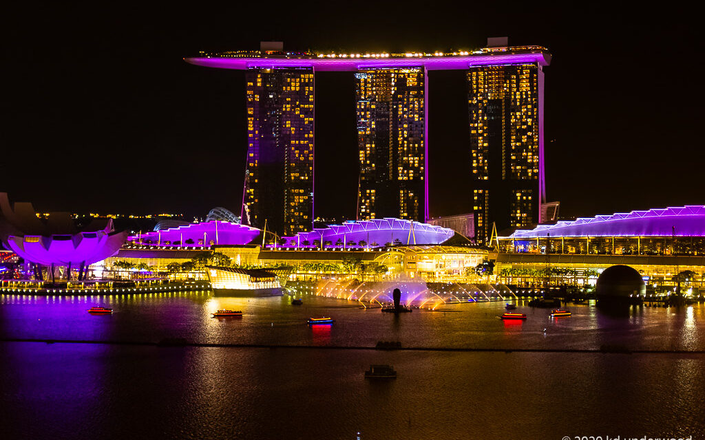 Singapore skyline with illuminated Marina Bay Sands.