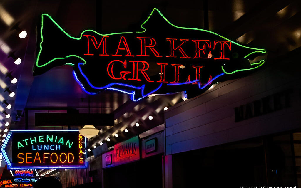 Neon signs at seafood market in Seattle.
